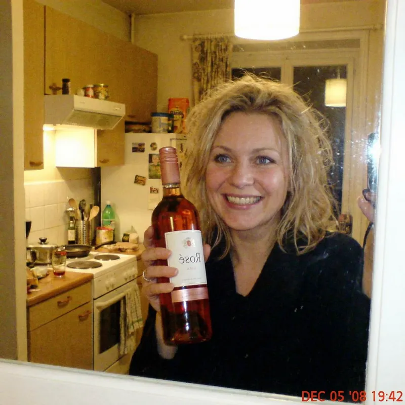 Blonde Woman Selfie with Blue Eyes and Rose Wine Blonde Woman Selfie with Blue Eyes and Rose Wine