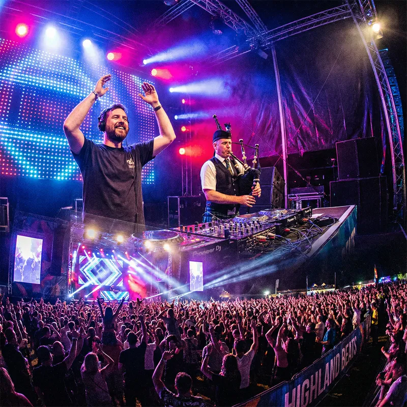 Dynamic EDM Festival Performance with Bagpipe Player