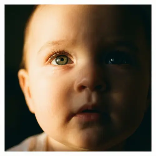 Innocence and Curiosity: Contrast Lighting on Baby's Face