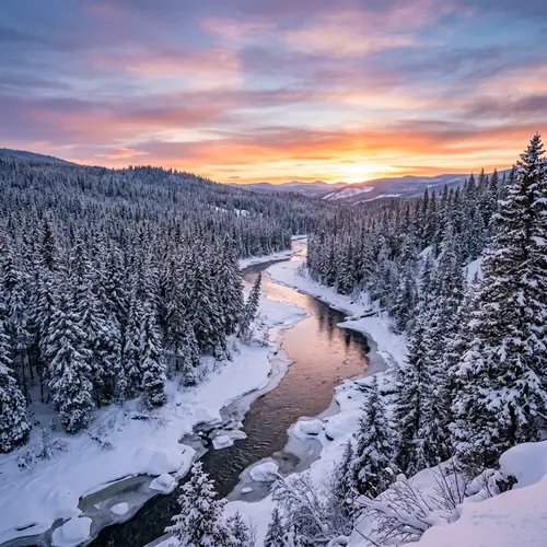 Tranquil Winter Forest Scene with Frozen River and Sunset Sky