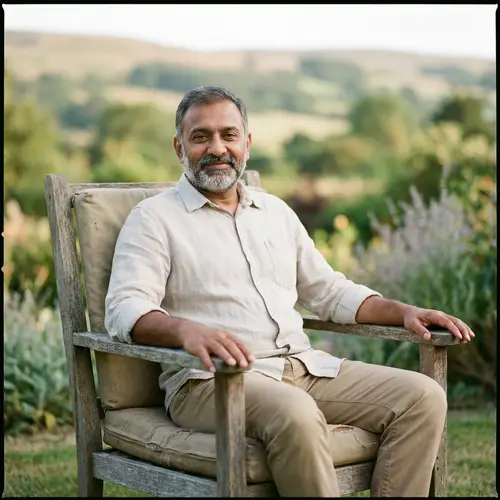 A Man Sitting on a Chair: Relaxed and Calm Vibes