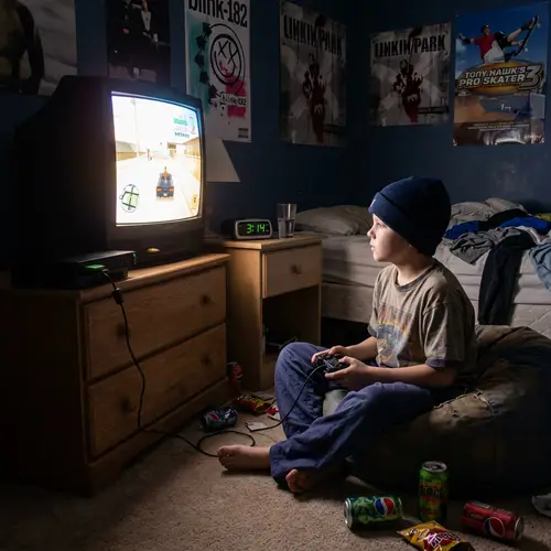 Young Boy Playing PS2 at 3 AM in Early 2000s