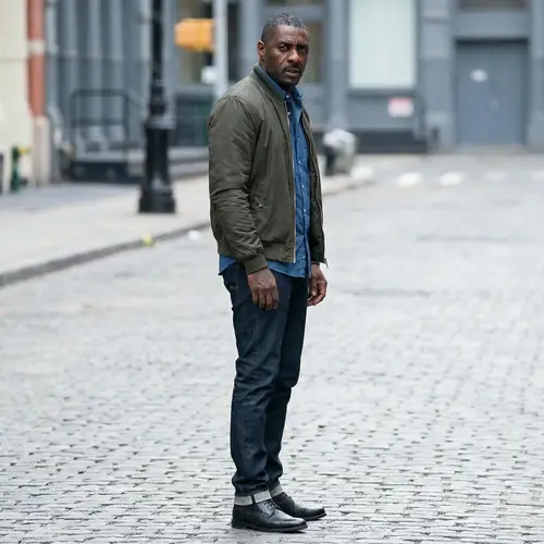 Idris Elba: Tense Profile in Green Bomber Jacket