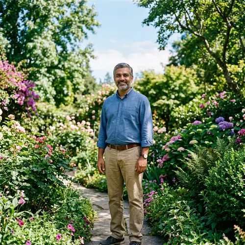 South Asian Man in Peaceful Garden | Welcoming Smile