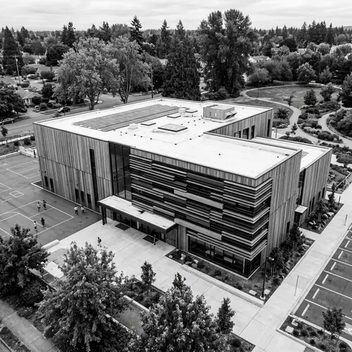 Modern Minimalist School Building with Wood and Metal Facades