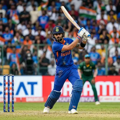 Male Indian Cricketer in Blue Attire with Cricket Bat