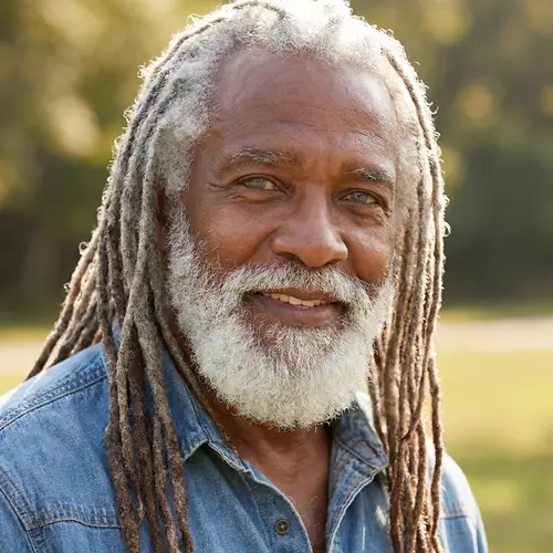 Elegant Older Black Man with White Beard & Gray Eyes