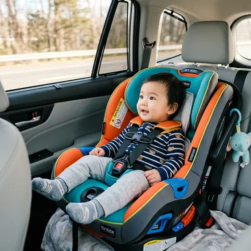 Asian Baby in Vibrant Child's Car Seat