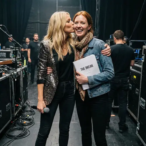 Blonde and Redheaded Women Embrace: Joyful Friendship Moment