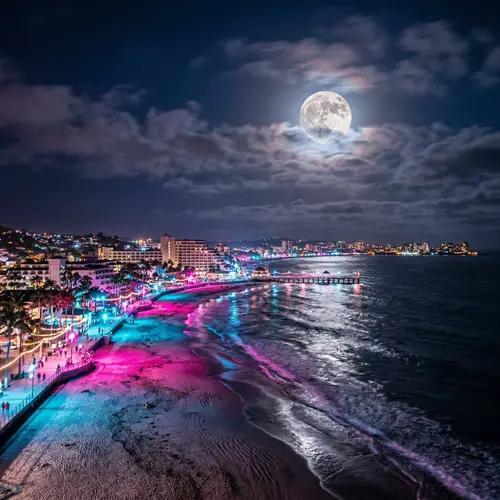 Illuminated Pink and Blue Shoreline Night Scene