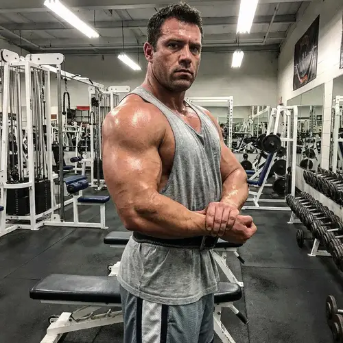 Dedicated Gym Enthusiast Flexing Muscles | Workout Inspiration