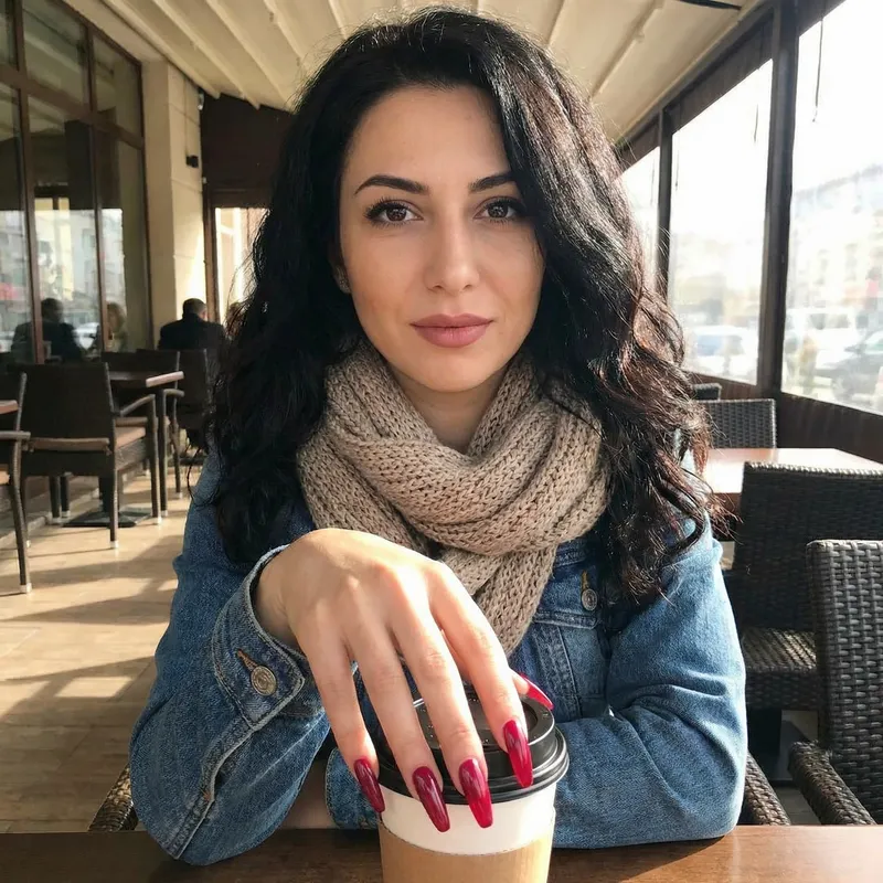 Stylish Lady with Long Red Nails