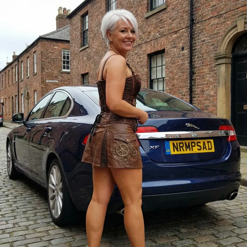 British Woman in Steampunk Skirt with Jaguar XF