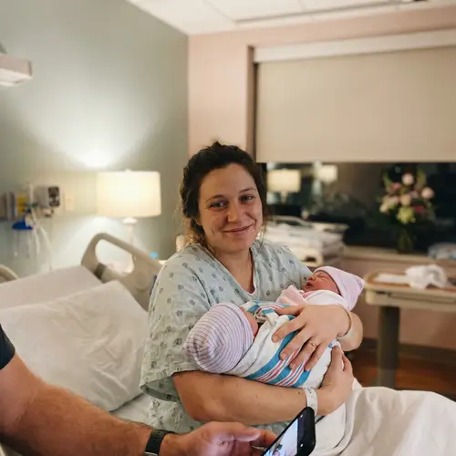 Heartwarming Birth Scene: Mother with Newborn Twins
