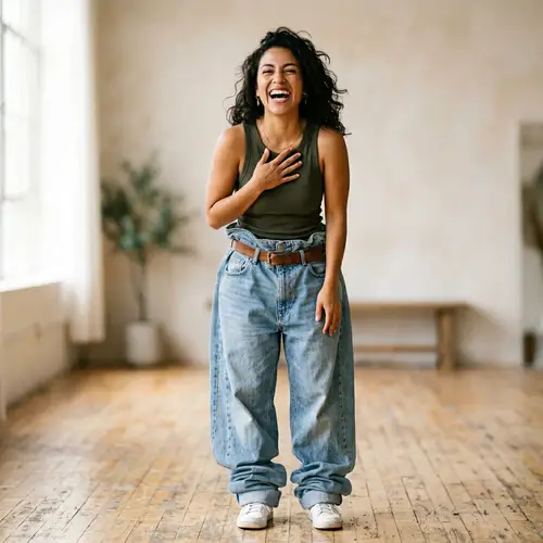 Joyful Latina Woman in Over-sized Denim Jeans | Smiling & Standing