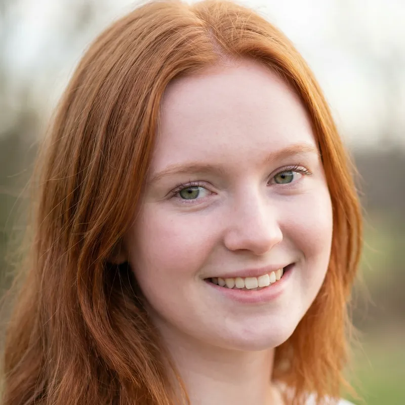 18-Year-Old Redhead Girl with Green Eyes and Rosy White Skin
