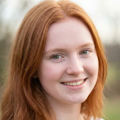 18-Year-Old Girl with Red Hair and Green Eyes