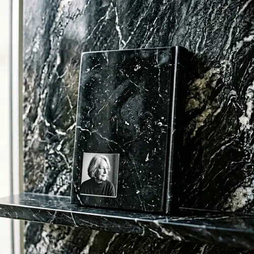 Intricate Textures on Black Marble Book with Author's Photo