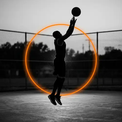 Elegant Mid-Air Basketball Player Silhouette | Sports Photography