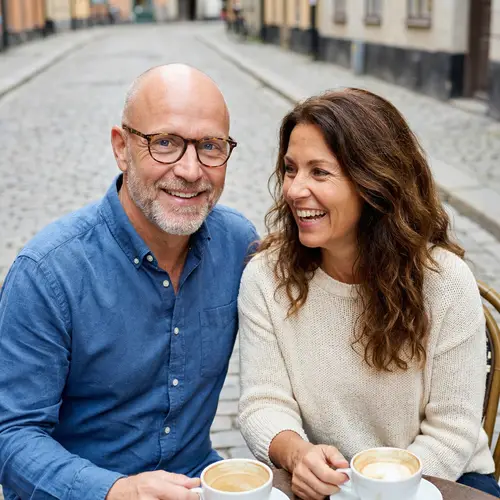 European Couple: Blue Eyes, Glasses, and Brown Hair