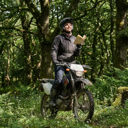 Middle-Eastern Girl on Motorcycle in Enchanted Forest
