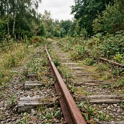 Rusted Iron Railroad Track: A Symbol of Forgotten Human Industry