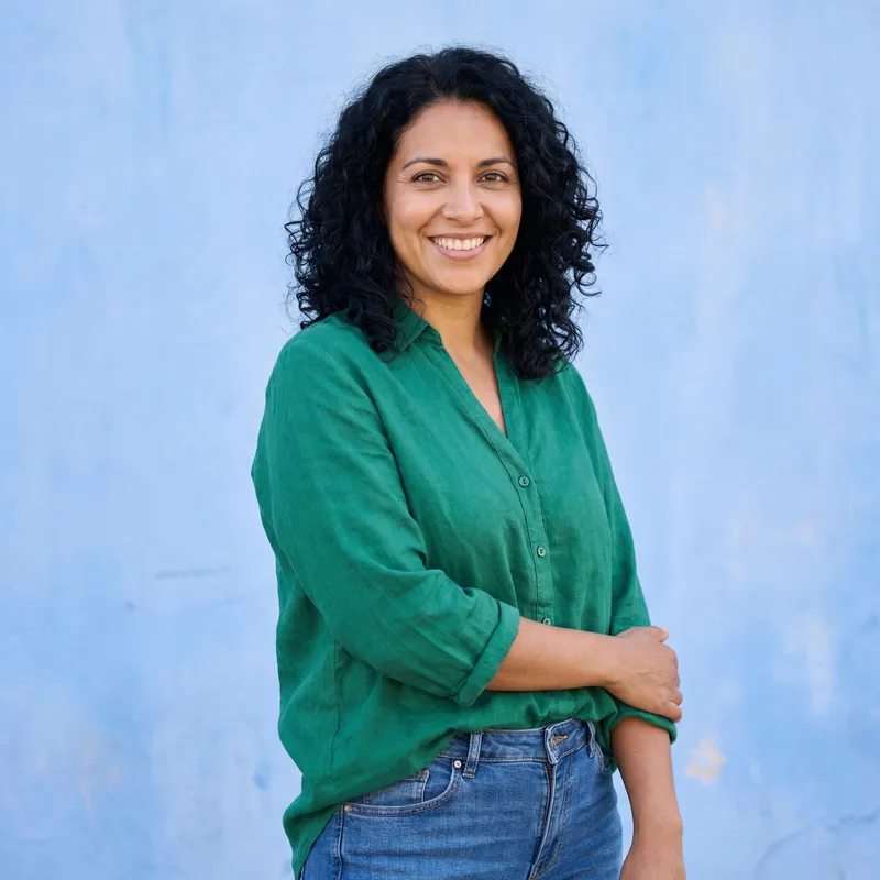Confident Hispanic Woman in Bright Green Blouse | Portrait Confident Hispanic Woman in Bright Green Blouse | Portrait