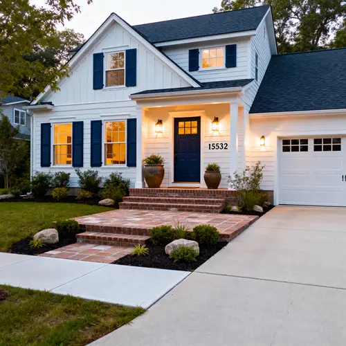 Traditional Home with Dark Blue Shutters and Landscaping