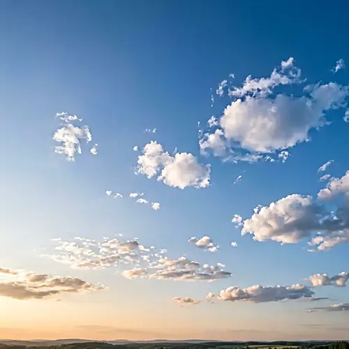 Tranquil Wide Expansive Sky: Vast Views of Golden Horizons & Fluffy Clouds