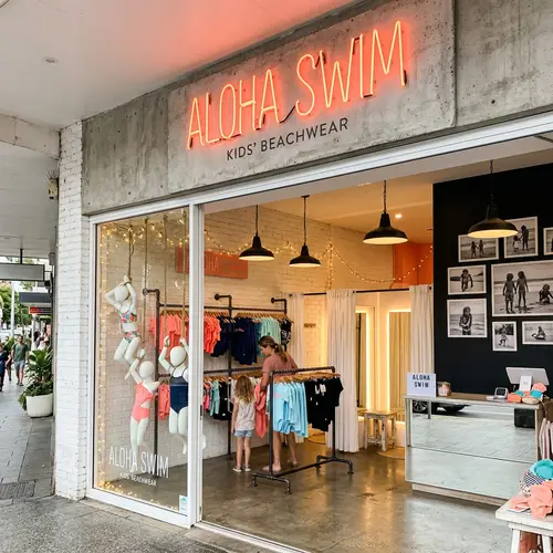 Aloha Swim Kids Swimwear Store | Shabby Chic Theme with Coral & Black Accents