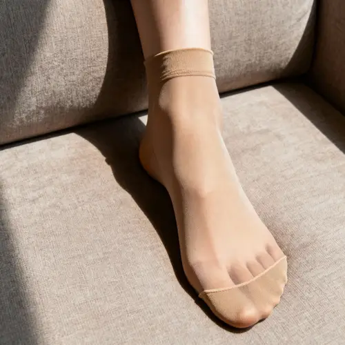 Stylish Female Foot in Tan Tights - 20 DEN