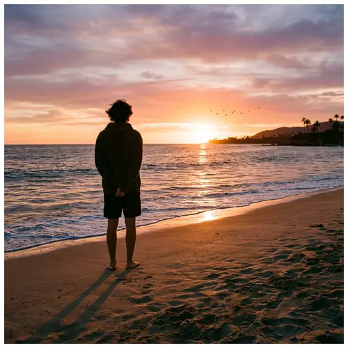 Tranquil Sunset Beach Scene with Long Shadow and Birds in Distance
