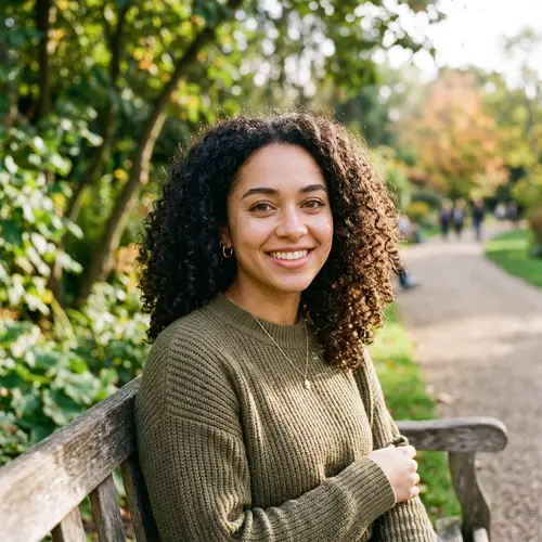 Young Woman with Dark Curly Hair and Brown Eyes