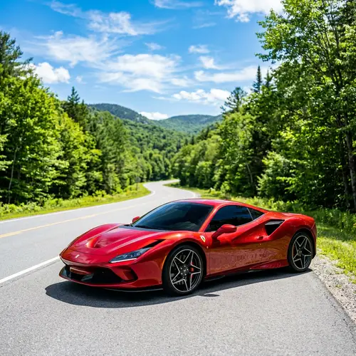 Sleek Red Sports Car Sparkling on Gray Asphalt Road