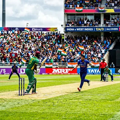 Exciting Cricket Match in Progress | Spectacular Outdoor Scene