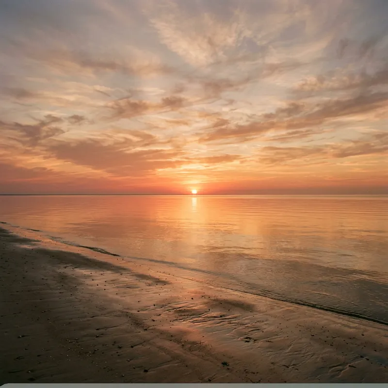 Tranquil Sunset over Calm Seashore | Infinite Ocean Vista