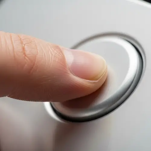 Close-Up of a Finger Pressing a Button