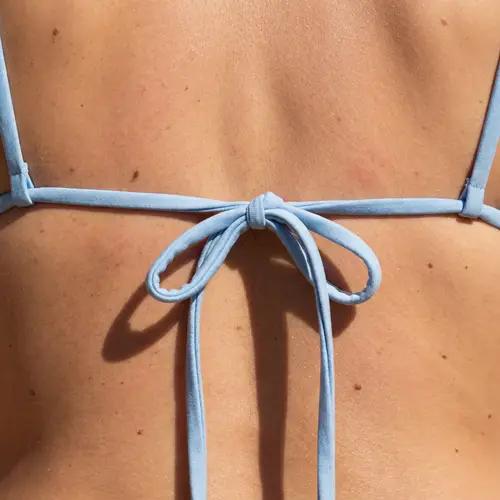 Intimate Fashion Detail: Woman's Back in Bikini Strings
