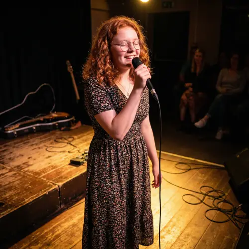 16-Year-Old Redhead Singing with Confidence