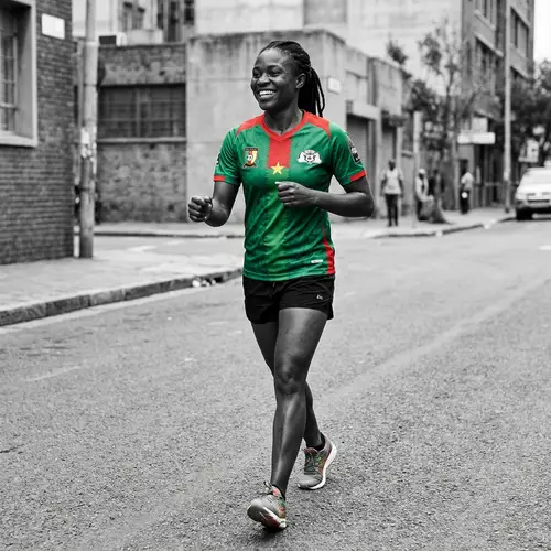 Athletic Black Woman in Burkina's National Football Jersey | Urban Portrait