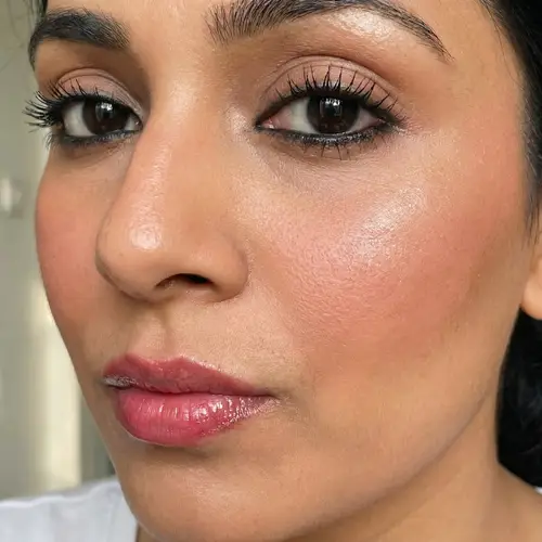 Woman with Piercing Black Eyes and Pouty Pink Lips