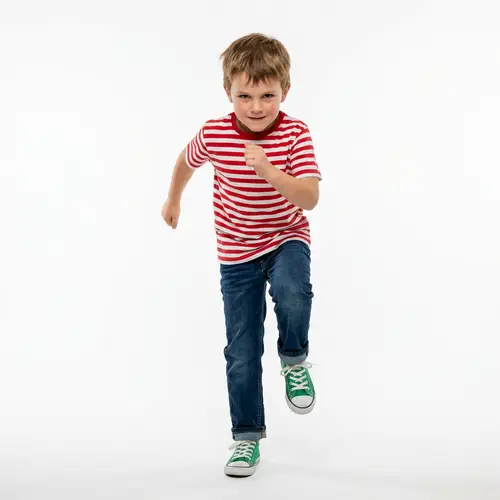 Energetic Young Boy Marching | Youthful Vigor & Purpose