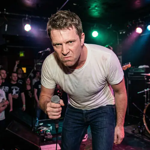 Dynamic Caucasian Male Musician Holding Microphone