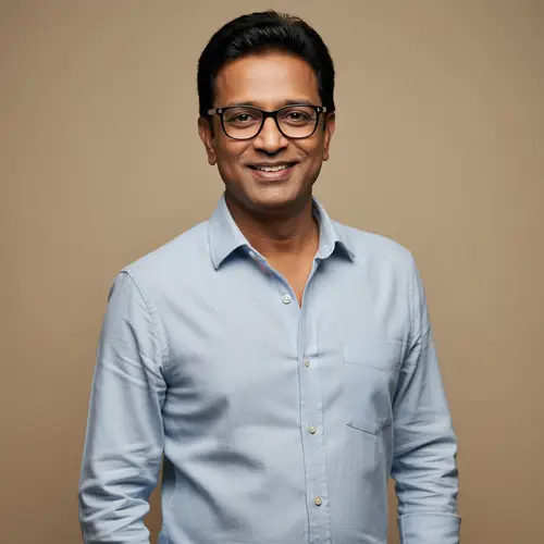 Confident Indian Guy with Glasses and Sharp Features