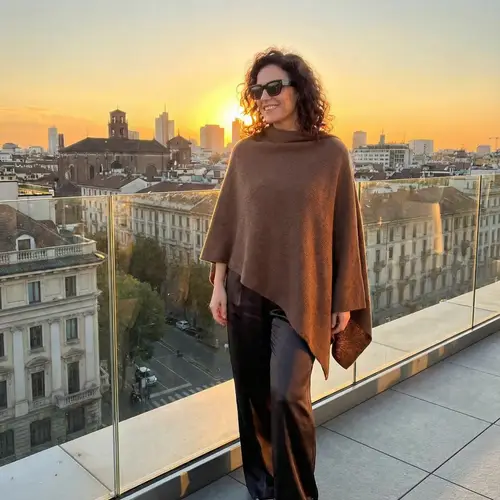 Golden Hour Portrait: Chic Urban Woman Overlooking City