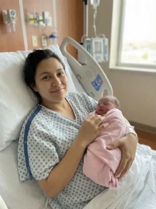 Holding My Baby Girl in the Hospital Bed