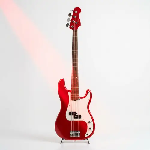 Vivid Red Bass Guitar - Harmonious Design with Gleaming Metal Strings