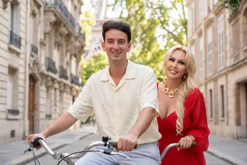 Couple Riding Tandem Bike in Beautiful City