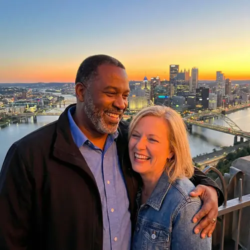 Urban Friendship Moment at Sunset with Diverse Couple