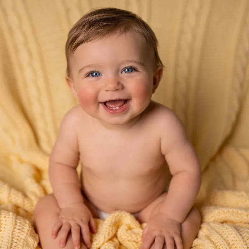 Joyful One-Year-Old Baby with Light Blue Eyes